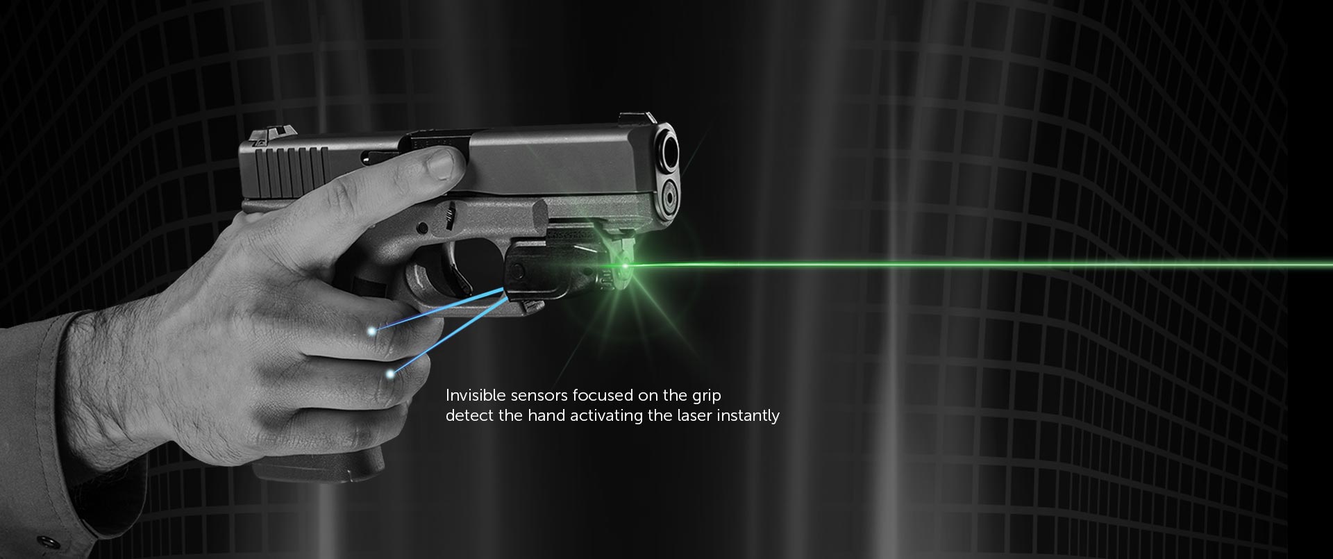 Black and White photo of a handgun with a laser sight attached